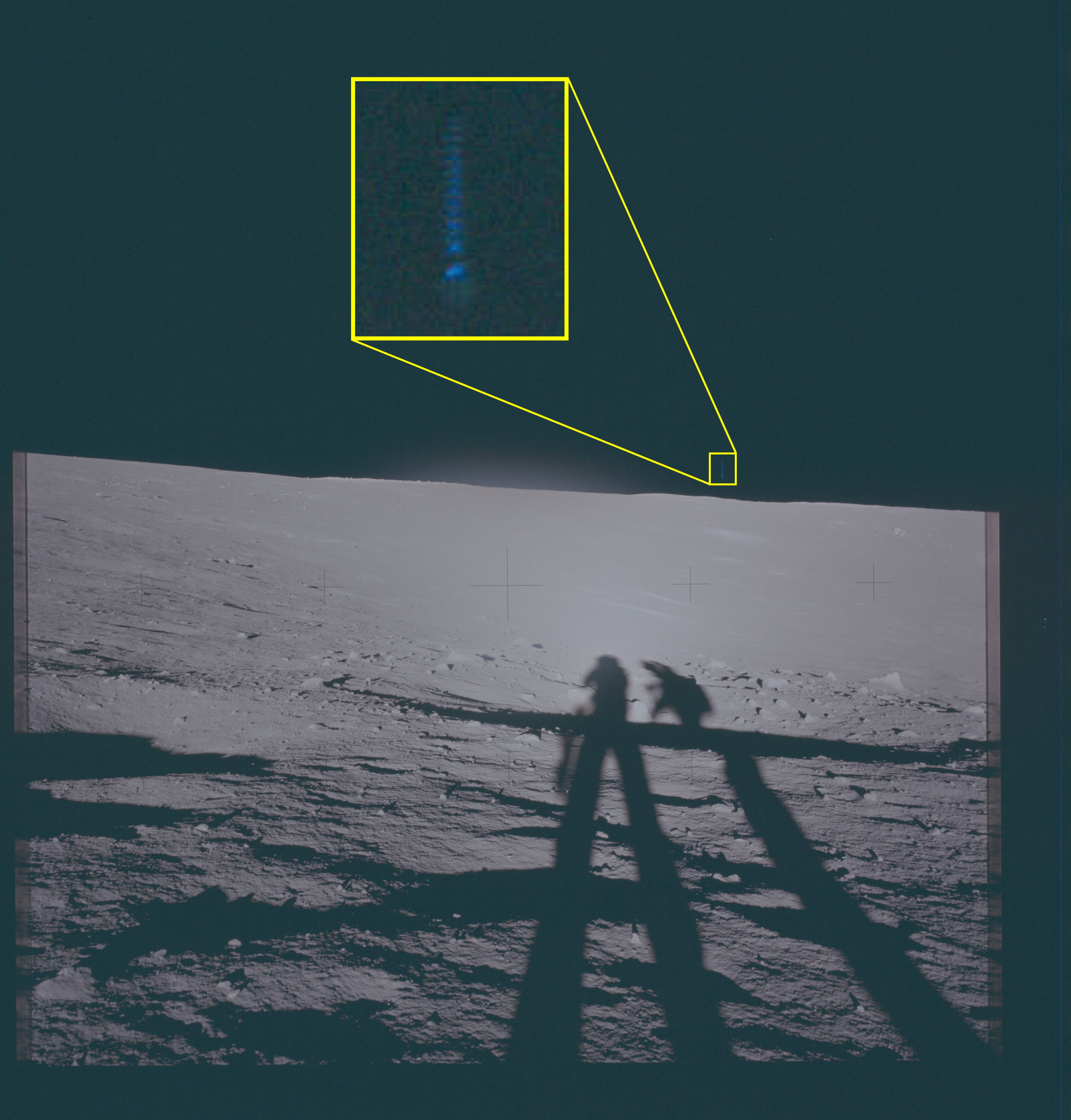 Photograph of the lunar surface showing astronaut shadows and a magnified callout of an object in the sky.